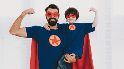 Father And Son In Superhero Suits. Family Concept.