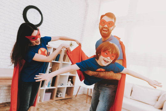 Superhero Family Are Having Fun On Holiday