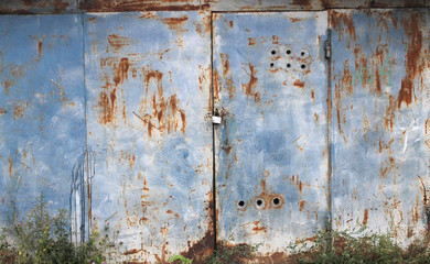 old garage doors/old painted textured weathered metal background
