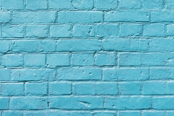 Painted brick surface close-up with celestial color of paint. Colorful grunge texture of wall....