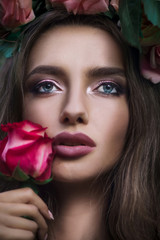 Beauty portrait of chubby lips sensual woman and roses.