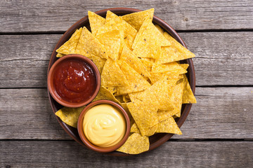 Crispy chips nachos with tomato and cheese sauce