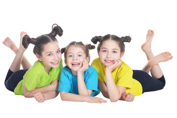 portrait of cute little girls posing on white background