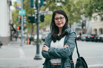business woman smiling and crossing arm