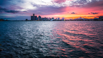 Sunset Over Detroit Michigan Skyline. Scenic sunset over the downtown waterfront cityscape of Detroit Michigan as seen from Sunset Point in Belle Isle State Park.