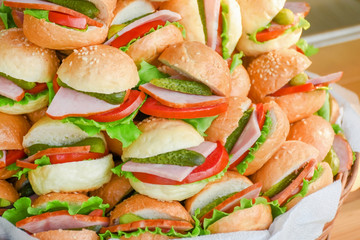 Hamburgers with bacon tomato cucumber and salad leaves