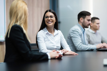 Portrait of smiling attractive businesswoman in office
