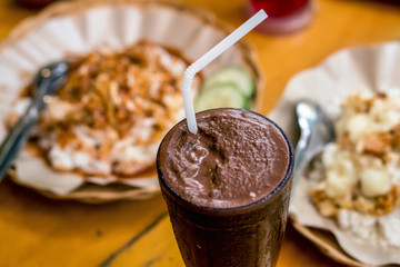 pounded chicken with melted cheese and fresh milkshake