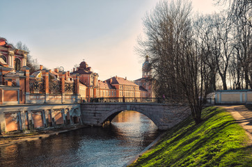 Fototapeta na wymiar The Monastyrka river and the First Lavrsky bridge.