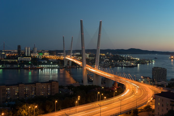Night view of the bridge of the Golden horn in summer. Vladivostok, Russia