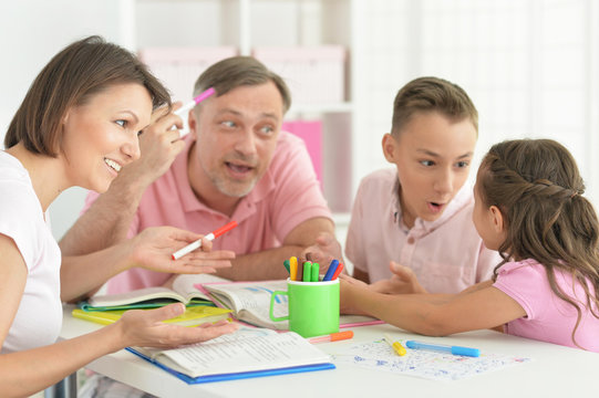 Big Happy Family Doing Homework At Home