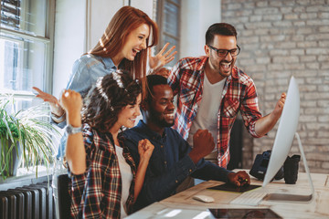 Young group of designers negotiates about design