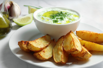 Tzatziki sauce with baked potatoes