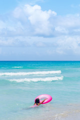 Fototapeta na wymiar Young Swimmer at a Famous Beach in Cuba