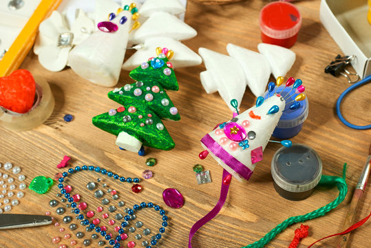Handmade decorations for new year and other holidays. Artwork workplace with creative accessories.