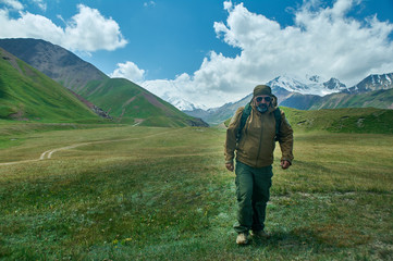 caucasian man with  backpacks View from p Pamir