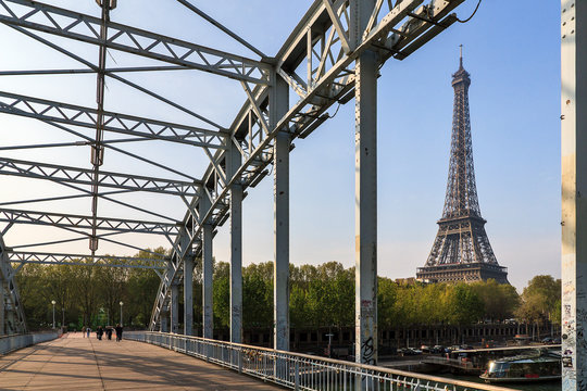 Beautiful view of the Eiffel tower from the Passerelle Debilly bridge in Paris in spring
