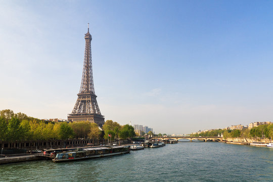 Beautiful view of the Eiffel tower from the Passerelle Debilly bridge in Paris in spring