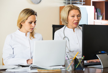 Two female doctors working together.
