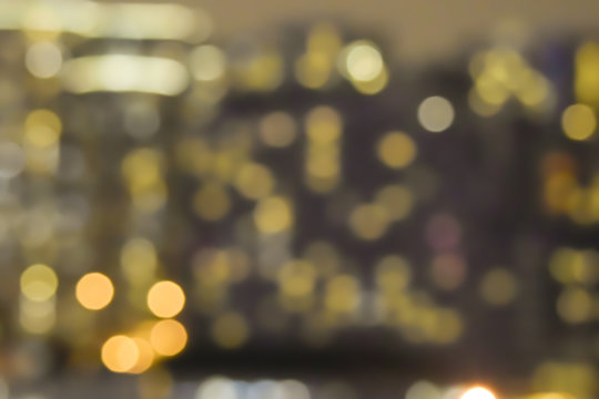 Abstract gold night building in the cityscape view light bokeh background.