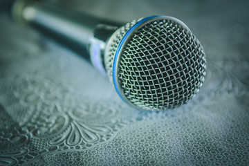 Closeup of Microphone on table in Conference Seminar room