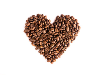 Coffee beans arranged as a heart shape on white background