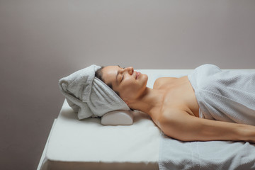 Woman Lying on a Massage Table