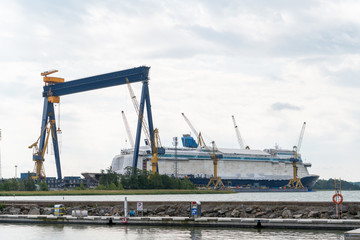 Fototapeta na wymiar Construction of a cruise liner at the shipyard
