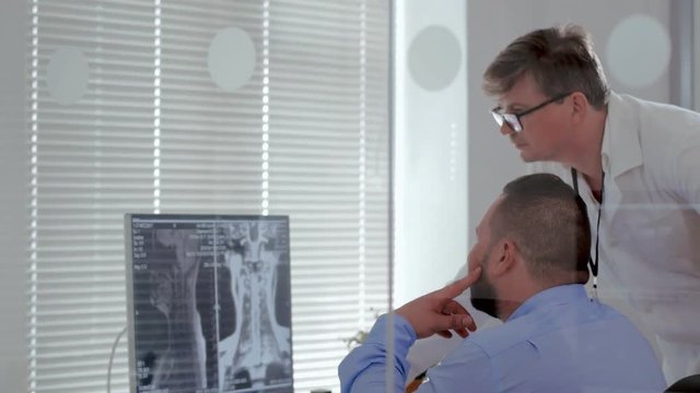 Doctors transplantologists study x-ray patient and diagnose brain disease