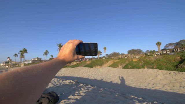 POV on the taking selfie photo on beach in Del Mar California in 4K slow motion 60fps