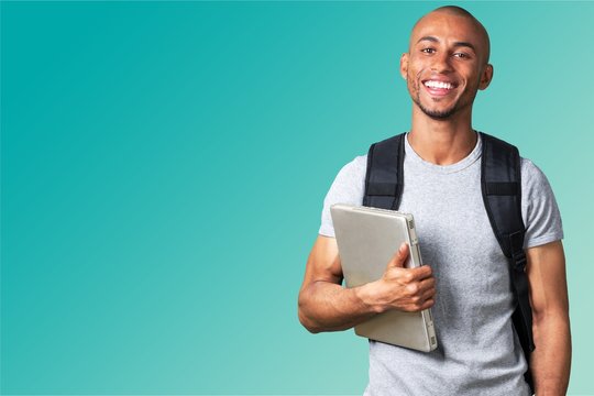 Male student with  backpack on  background