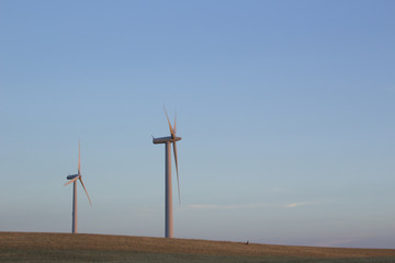 Wind turbines at a field for agriculture in the island of Jylland, Denmark.
