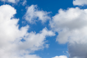White fluffy clouds in the blue sky