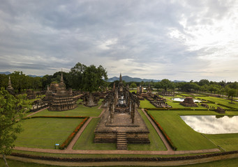 Aerial View of a historical sites ruins Buddhist Temple Wat Mahathat at The Sukhothai Historical Park, a registered UNESCO World Heritage City in the tranquil late afternoon sun