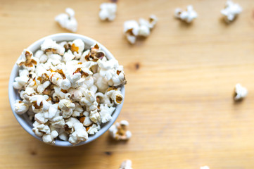 Popcorn on wooden table