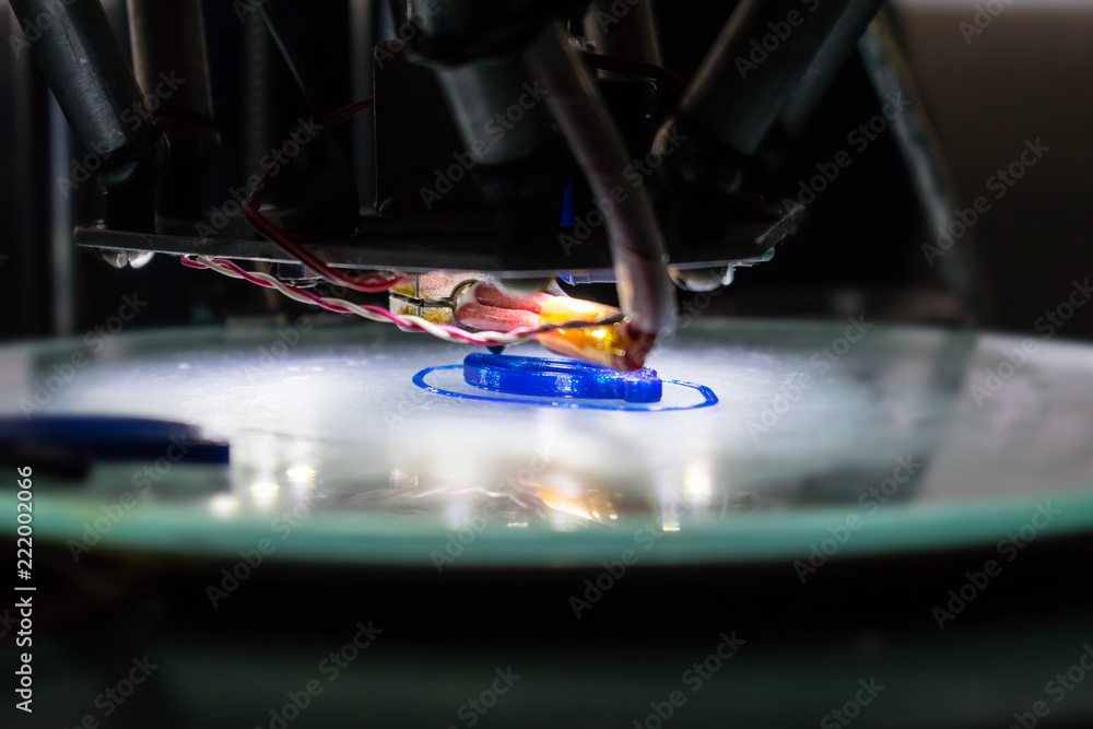 Poster 3d printing process close up. automatic three dimensional 3d printer mechanism prints polymer blue p