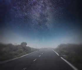 starry night sky above the road.