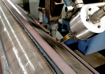 Overlay welding hard surfacing of steel roll by submerged arc welding process