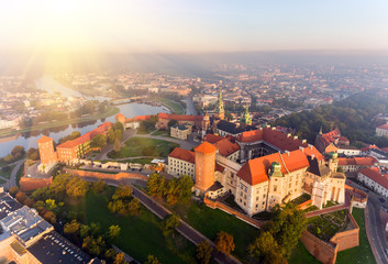 Fototapeta Aerial view Royal Wawel Castle and Gothic Cathedral in Cracow, Poland, with Renaissance Sigismund Chapel with golden dome, fortified walls, yard, park and tourists. obraz