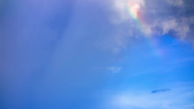 Time lapse rainbow revealed after rain clouds 4k.