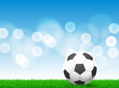 soccer ball on grass with bokeh background