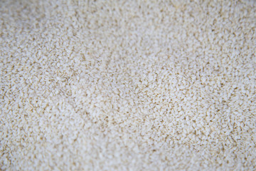 White sesame seeds background