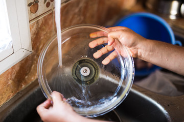 Man washing dishes in the kitchen