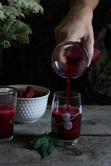 Fresh homemade raspberry juice made of 100%  organic fruit. Summer season. Healthy lifestyle