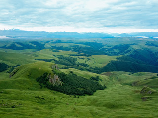 Fototapeta premium View from the drone from the air. The landscape of the valley from a plateau Bermamyt the North Caucasus at sunrise.