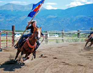 Woman Gallops with Colorado Flag