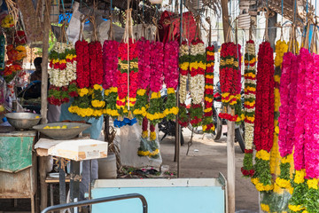 Colourful garlands for sale in the flower market at Madurai.They are widely used for dedications in Hindu rituals and for decorating festive occasions