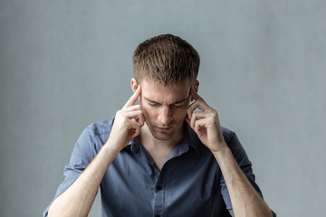 Caucasian business man Stress and have a migraine push finger on head after lost and have a problem...