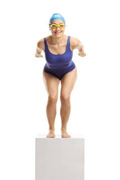 Female swimmer prepared to jump