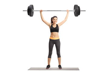 Young woman exercising with a barbell